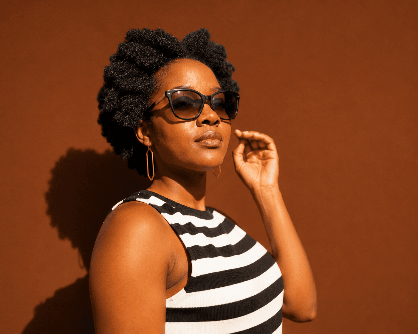 Natural hair portrait with sunglasses