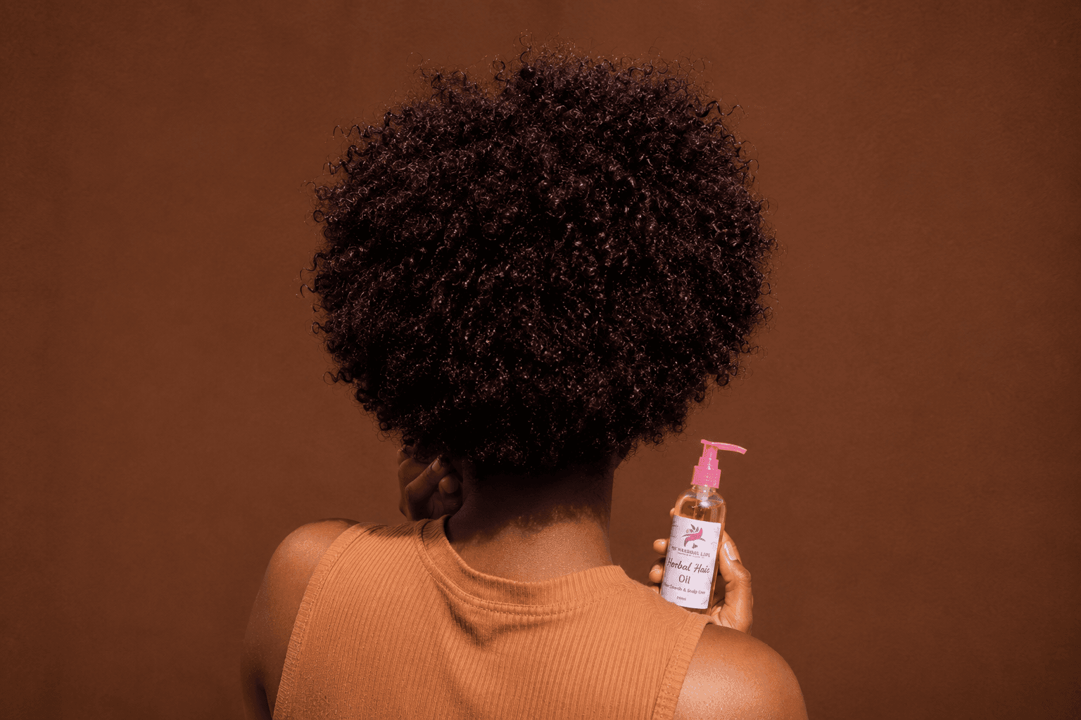 Natural hair with herbal oil bottle